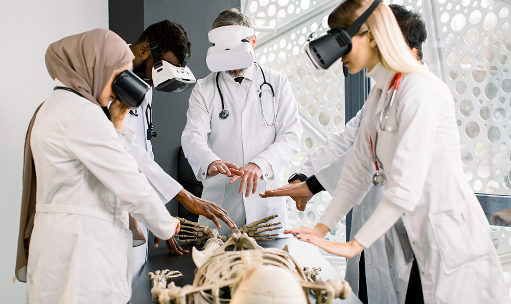 Group of multiethnic students or interns study human anatomy with VR glasses.